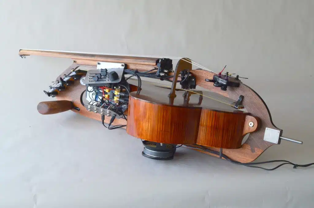 An uncommon instrument, the halldorophone, resting on a white floor.