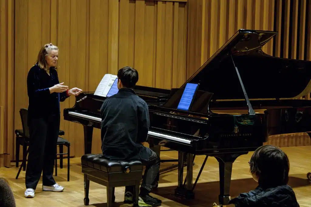 Kathryn Stott and a young musician at Young Sounds UK's Thrive Piano Masterclass at Chetham's School of Music