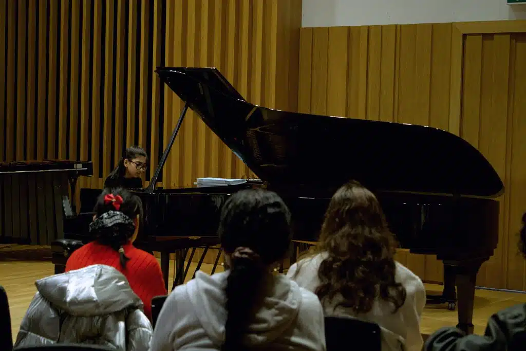 Kathryn Stott and a young musician at Young Sounds UK's Thrive Piano Masterclass at Chetham's School of Music